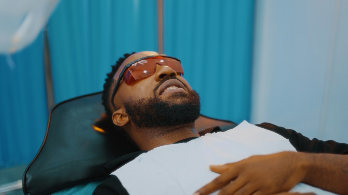 A man lying back in a dental chair